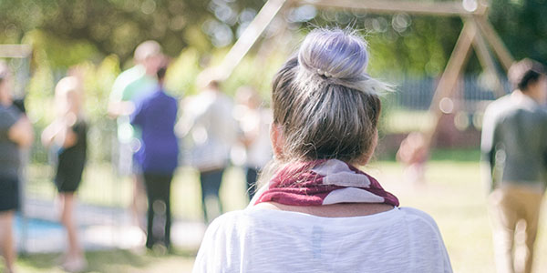 Photo of older woman walking from behind