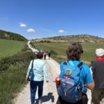 Hiking to the charming town of Sanguesa where a midmorning feast and wine awaits us, 2023.