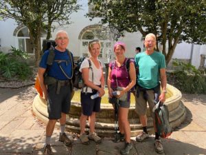 Bruce Cass Friends Pilgrim Office, group photo and fountain.